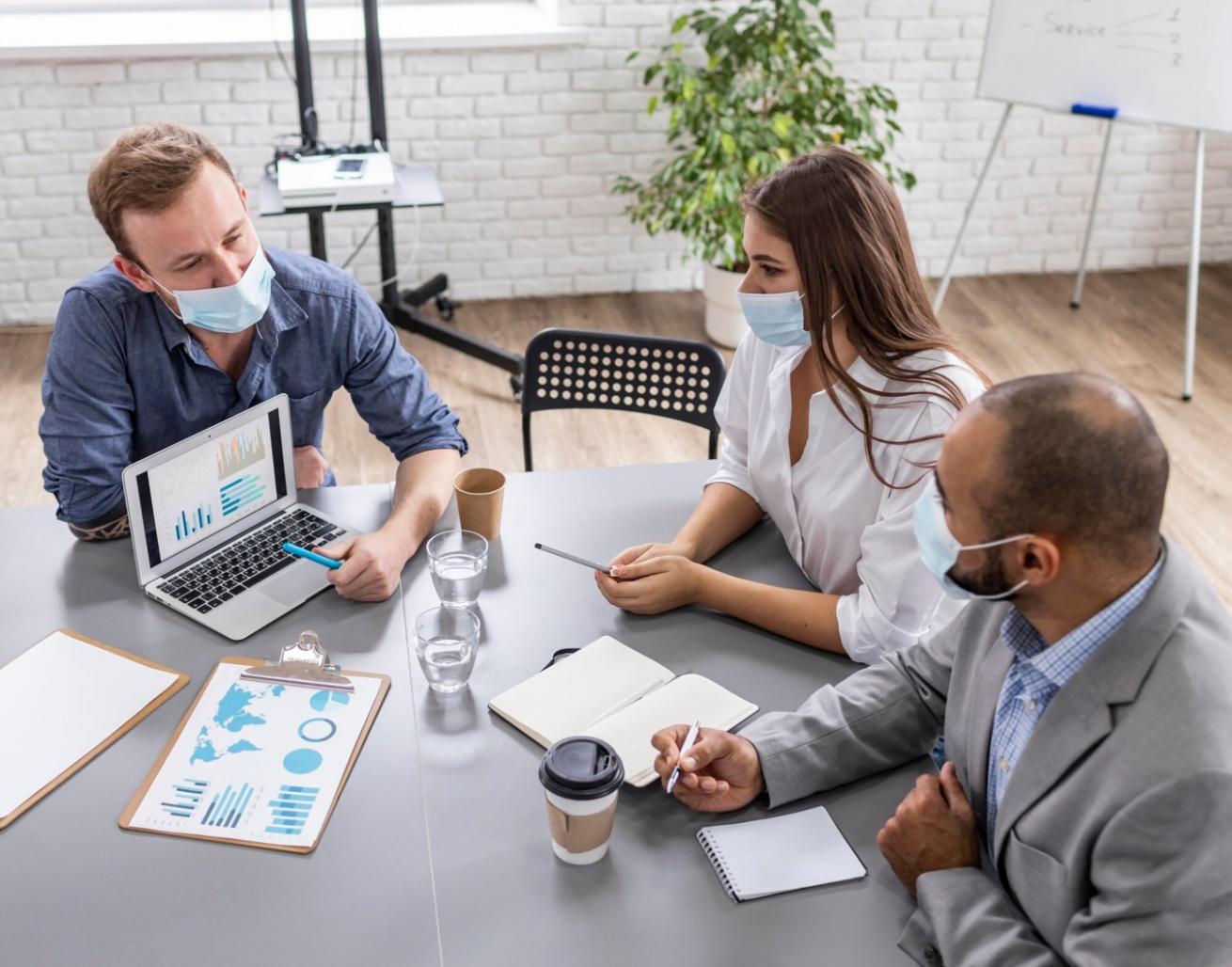 Person reviewing financial documents and charts